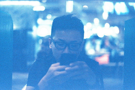 a man is looking at his cell phone