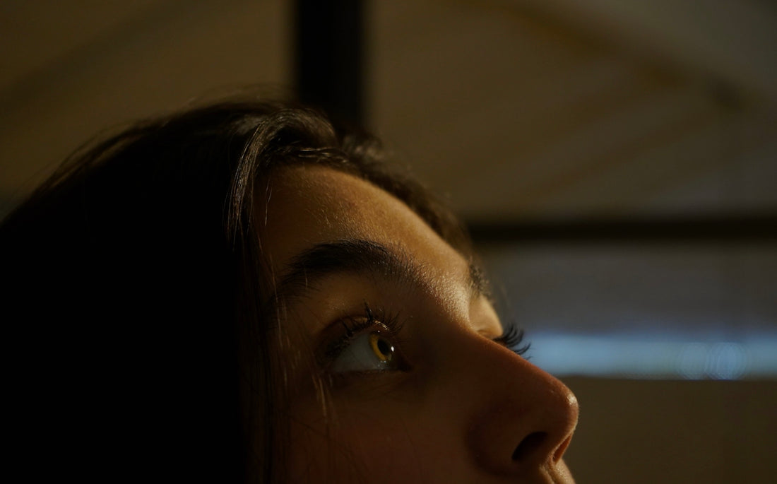 a close up of a woman's face with a blurry background
